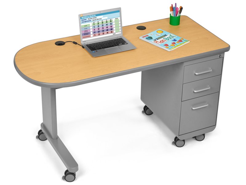 teacher using computer and desk